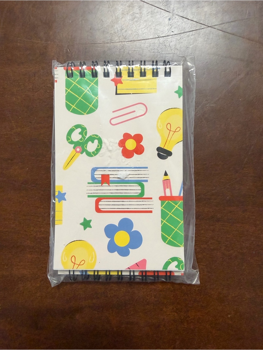 Spiral Notebook with Colorful School Icons - White Background